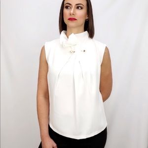 Front tuck brooch neck blouse